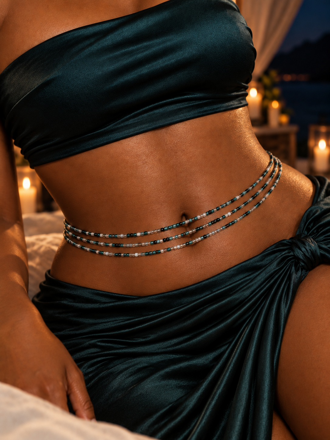 Detail of Midnight Rain waist beads against a black outfit