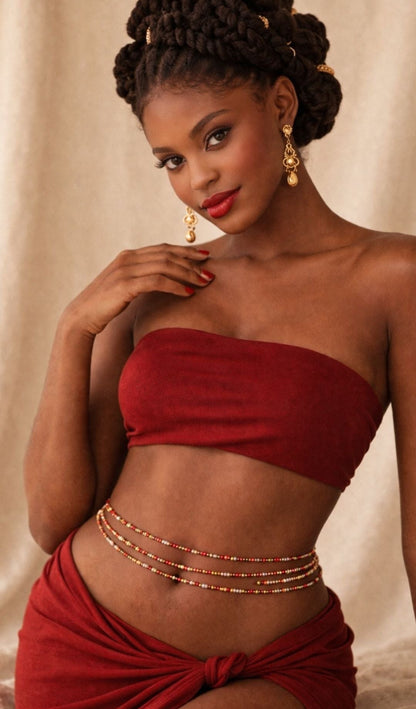 Model wearing Lover Girl waist beads with a white wrap outfit