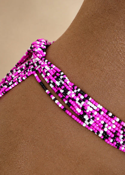 Charisma hot pink, black and white tie-on waist beads displayed on a mannequin torso